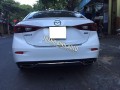 Lip sau 2 pô kiểu Mer xe MAZDA 3 AN