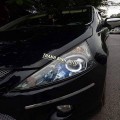 Mitsubishi Grandis độ bi xenon và enro