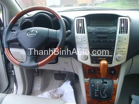 Khâu da vô lăng sơn vân gỗ cho xe Camry